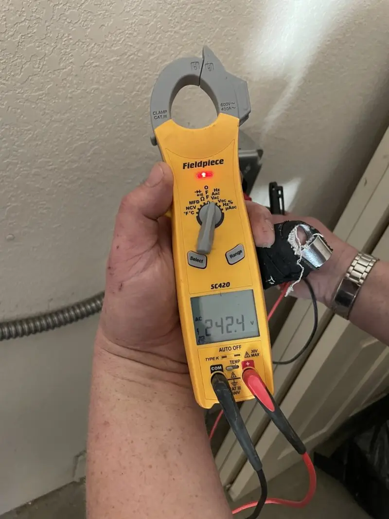 Voltage testing with clamp meter during Circuit Breaker Repair in New Ipswich